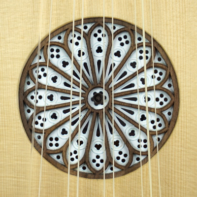 Soundhole rose - wood and parchment, resembling a church window